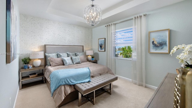 bedroom featuring light carpet, a raised ceiling, and an inviting chandelier