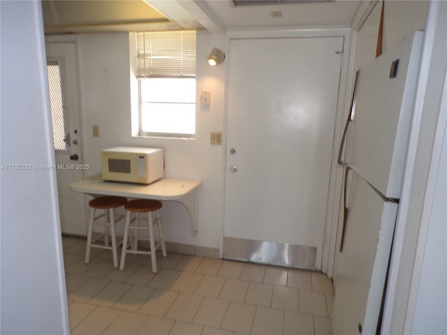 kitchen with white appliances and light countertops