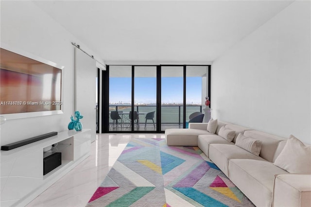 living area featuring marble finish floor and a wall of windows