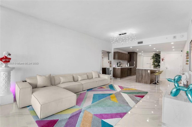 living area featuring marble finish floor and visible vents