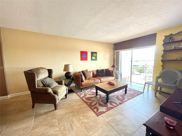 living room with light tile patterned floors and a textured ceiling