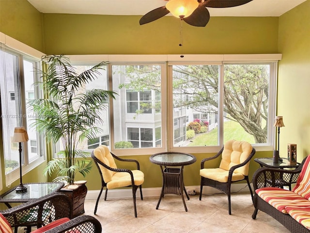 sunroom / solarium featuring ceiling fan and a wealth of natural light