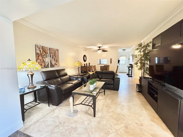 tiled living room with ornamental molding and ceiling fan