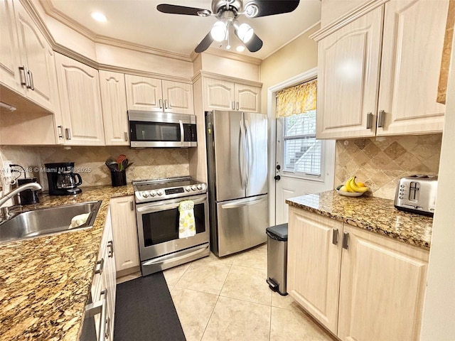 kitchen featuring light tile patterned flooring, sink, stainless steel appliances, light stone countertops, and decorative backsplash