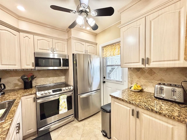 kitchen featuring stone countertops, light tile patterned floors, ornamental molding, appliances with stainless steel finishes, and backsplash