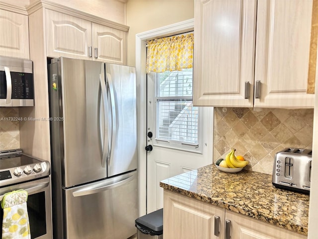 kitchen featuring tasteful backsplash, appliances with stainless steel finishes, stone countertops, and light brown cabinets