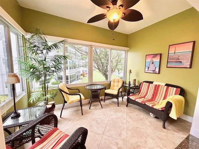 sunroom / solarium featuring ceiling fan and plenty of natural light