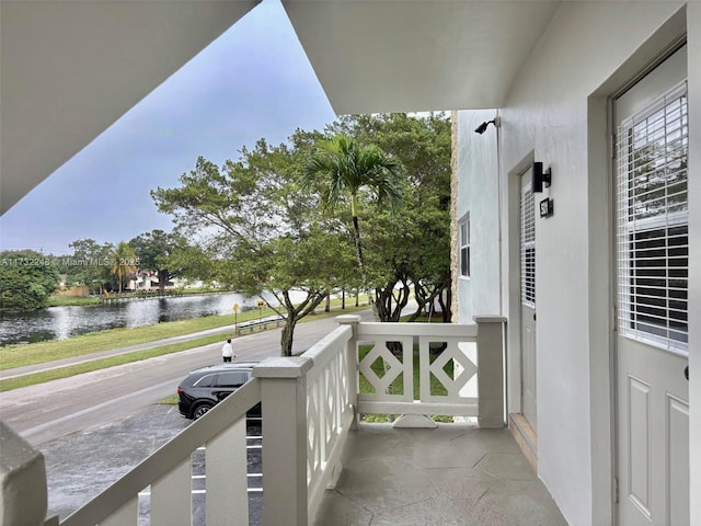 balcony featuring a water view