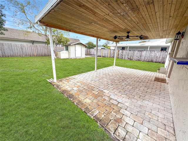 view of patio with a shed and ceiling fan