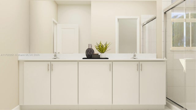 bathroom with vanity and an enclosed shower