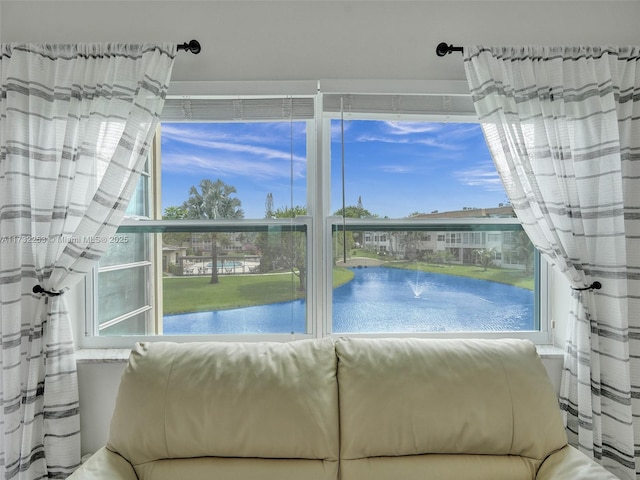 unfurnished sunroom with a water view