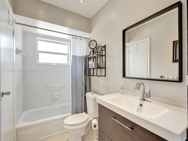 full bathroom with vanity, shower / tub combo with curtain, and toilet