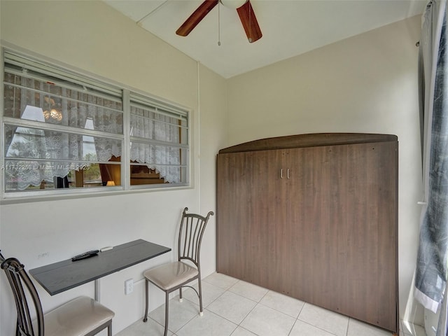 tiled home office with ceiling fan