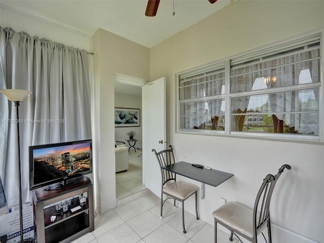 dining room featuring ceiling fan and light tile patterned flooring