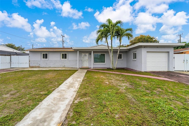 single story home with a garage and a front yard