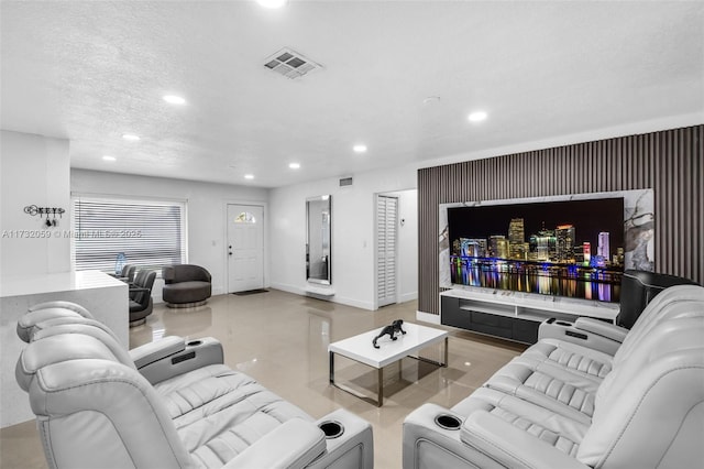 living room with a textured ceiling