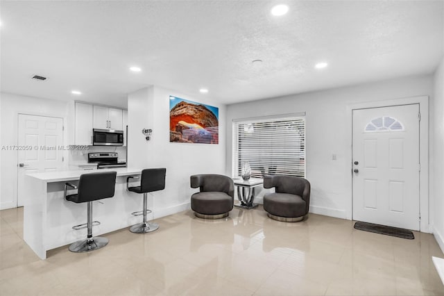 interior space with a textured ceiling