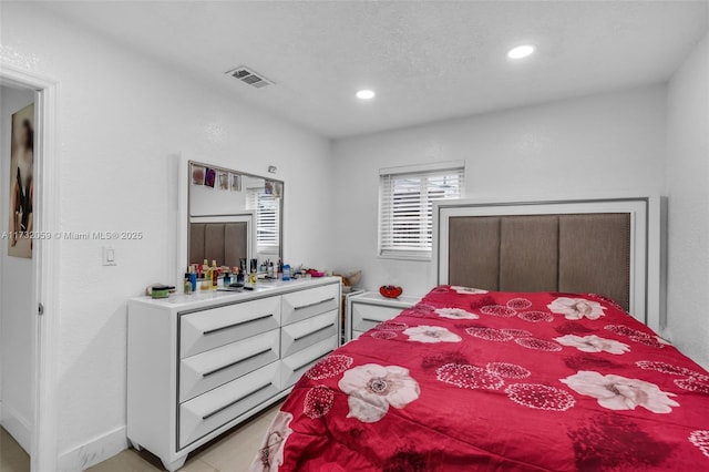 bedroom featuring light tile patterned floors