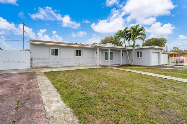 single story home with a garage and a front yard