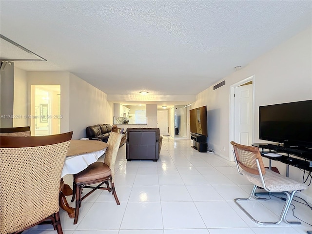 tiled living room with a textured ceiling