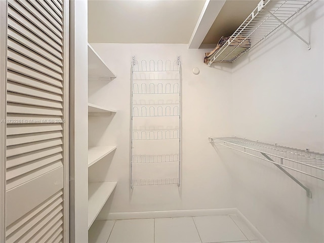 spacious closet featuring tile patterned floors