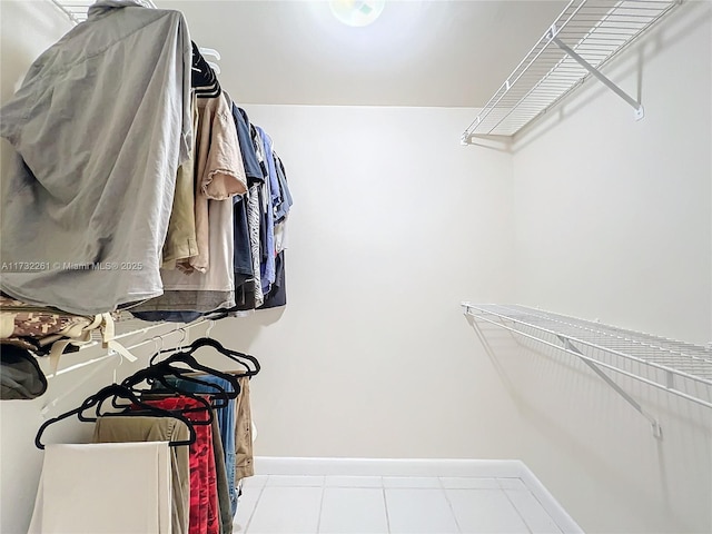 spacious closet featuring light tile patterned floors