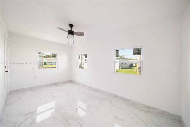 spare room featuring ceiling fan