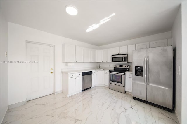 kitchen with white cabinetry, sink, and appliances with stainless steel finishes