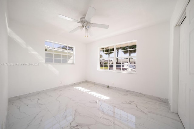 unfurnished room featuring ceiling fan