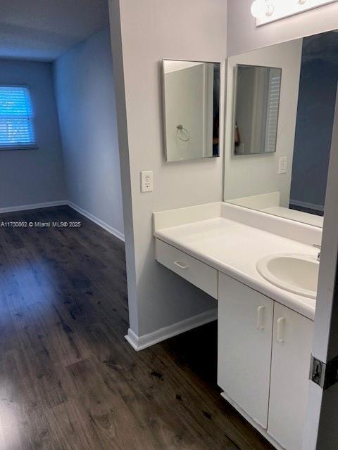 bathroom featuring vanity and wood-type flooring