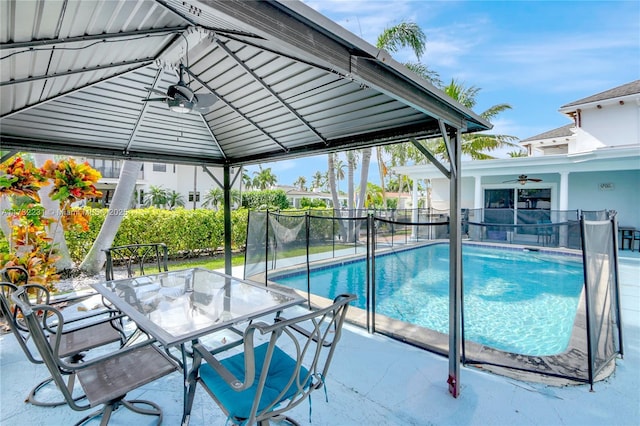 view of pool featuring a gazebo, ceiling fan, and a patio