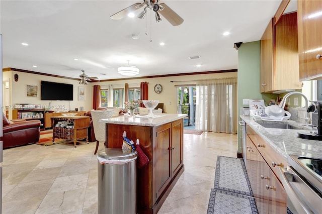 kitchen with sink, crown molding, ceiling fan, range with electric stovetop, and light stone countertops