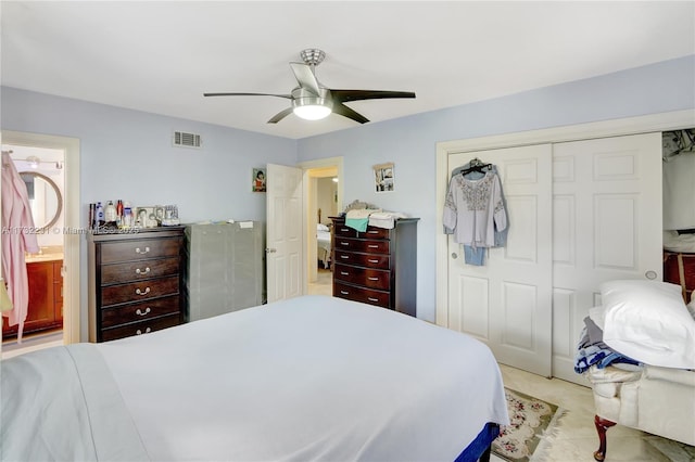 bedroom featuring connected bathroom, a closet, and ceiling fan