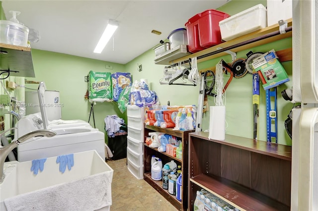 clothes washing area featuring separate washer and dryer