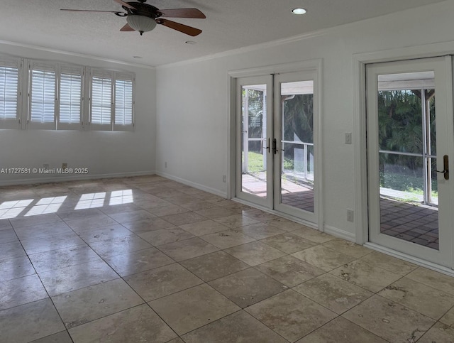 spare room featuring ceiling fan, baseboards, crown molding, and french doors