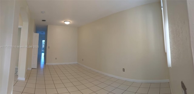 empty room featuring light tile patterned floors