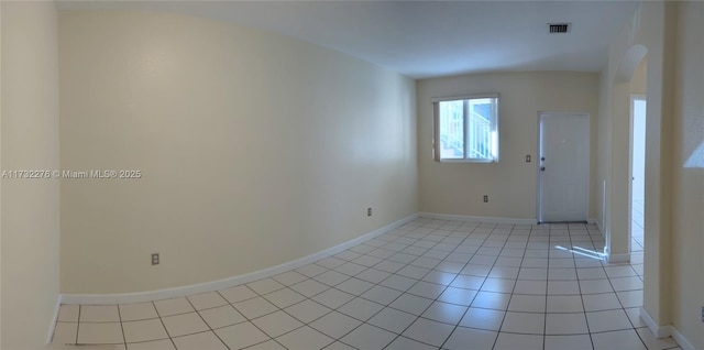 unfurnished room featuring light tile patterned flooring