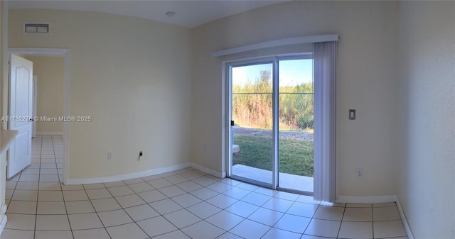 doorway featuring light tile patterned flooring