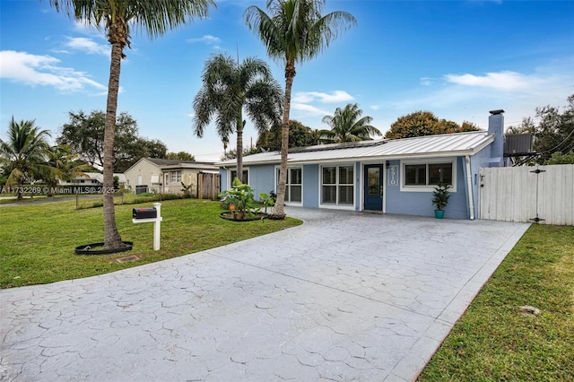 ranch-style home with a front yard