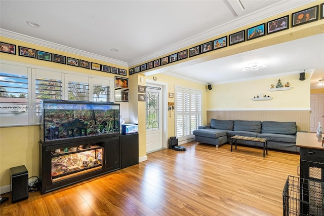 living room featuring crown molding and hardwood / wood-style floors