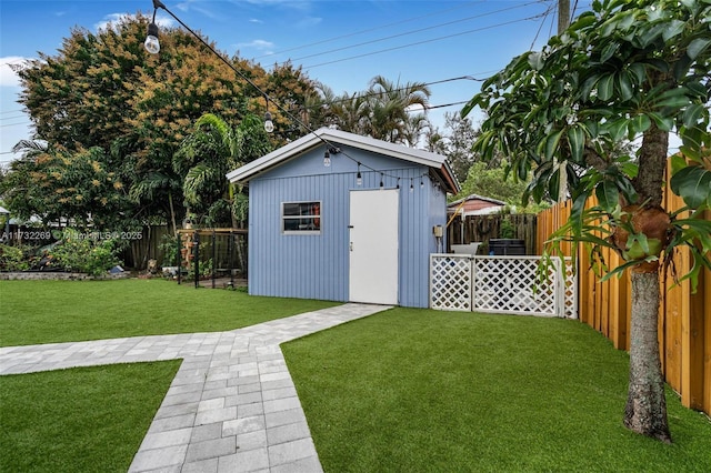 view of outbuilding featuring a yard