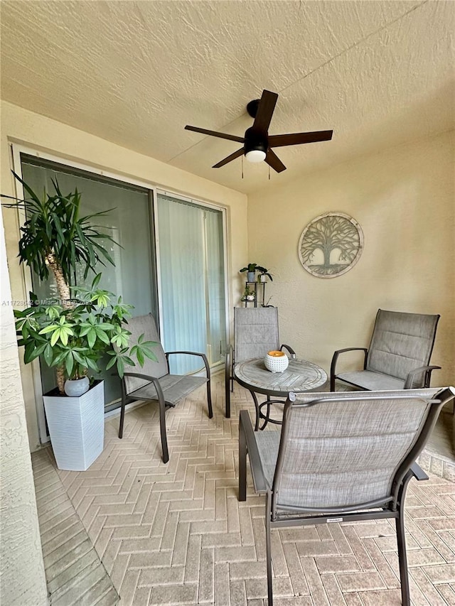 view of patio featuring ceiling fan