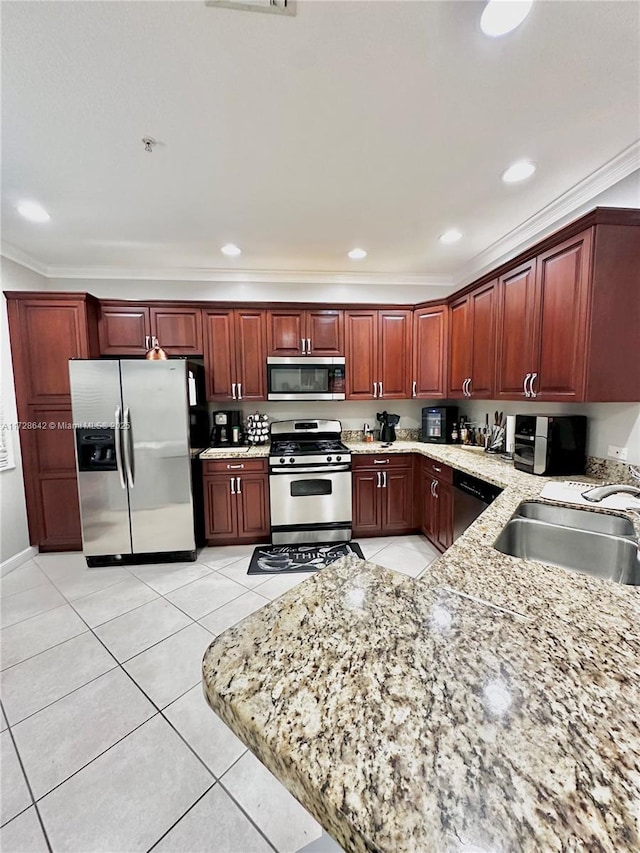 kitchen with light stone counters, sink, crown molding, and appliances with stainless steel finishes