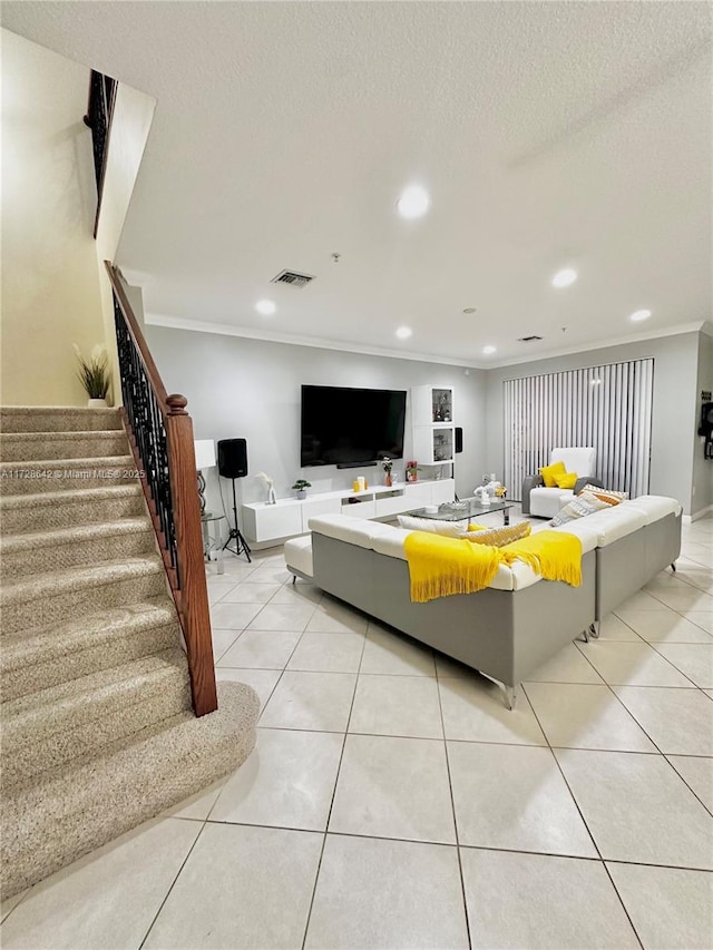 tiled living room with crown molding and a textured ceiling