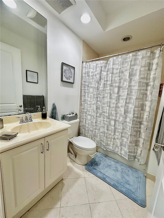 full bathroom with vanity, tile patterned floors, shower / bath combination with curtain, and toilet