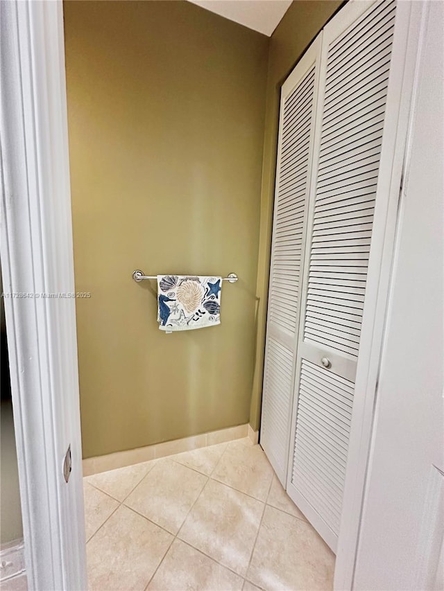 bathroom with tile patterned floors