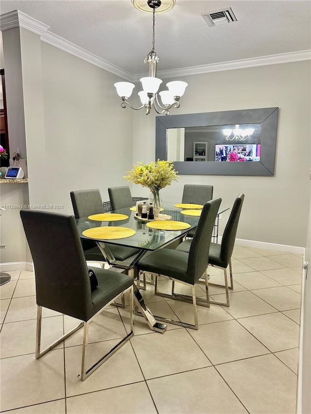 dining area featuring light tile patterned flooring, crown molding, and a chandelier