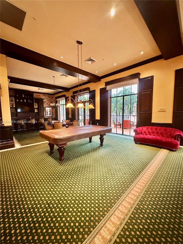 recreation room featuring ornamental molding and carpet