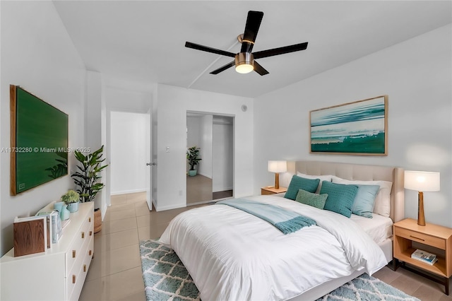 tiled bedroom with a closet and ceiling fan