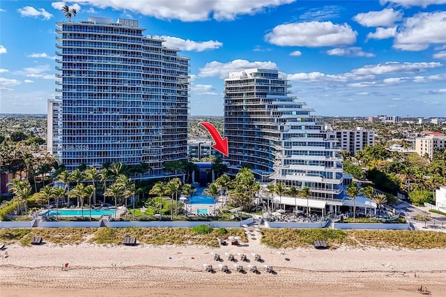 view of building exterior featuring a beach view